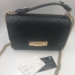 CHANEL
Black Quilted Leather Label Click Flap Bag